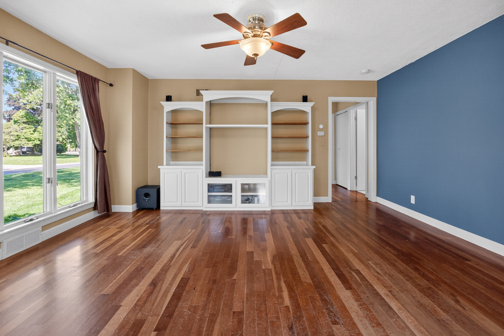 18 Mc Cormick Boulevard Normal, IL 61761 - Photo 4 of 25 a view of wooden floor and a chandelier fan in a room