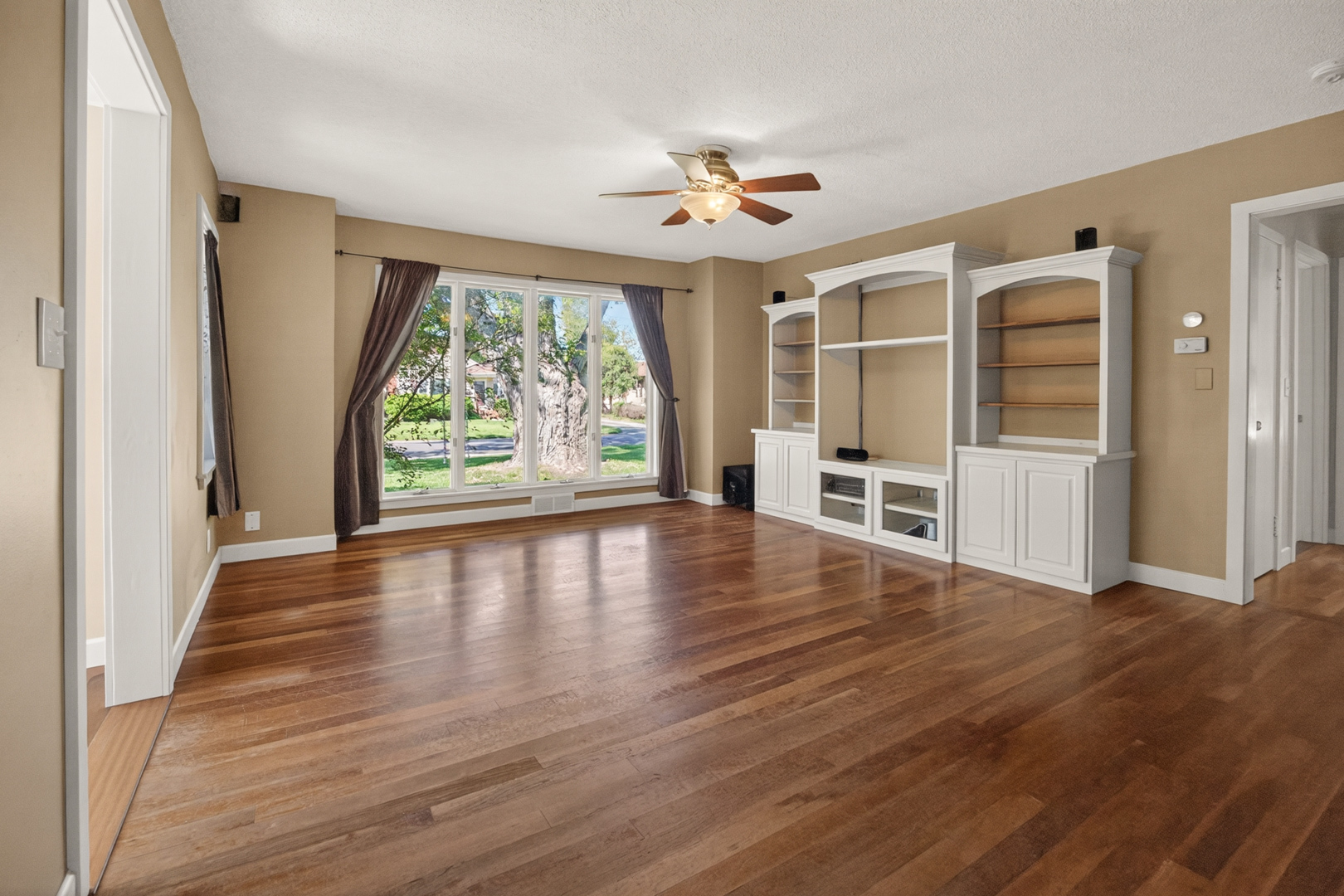 18 Mc Cormick Boulevard Normal, IL 61761 - Photo 5 of 25 wooden floor in an empty room with a window