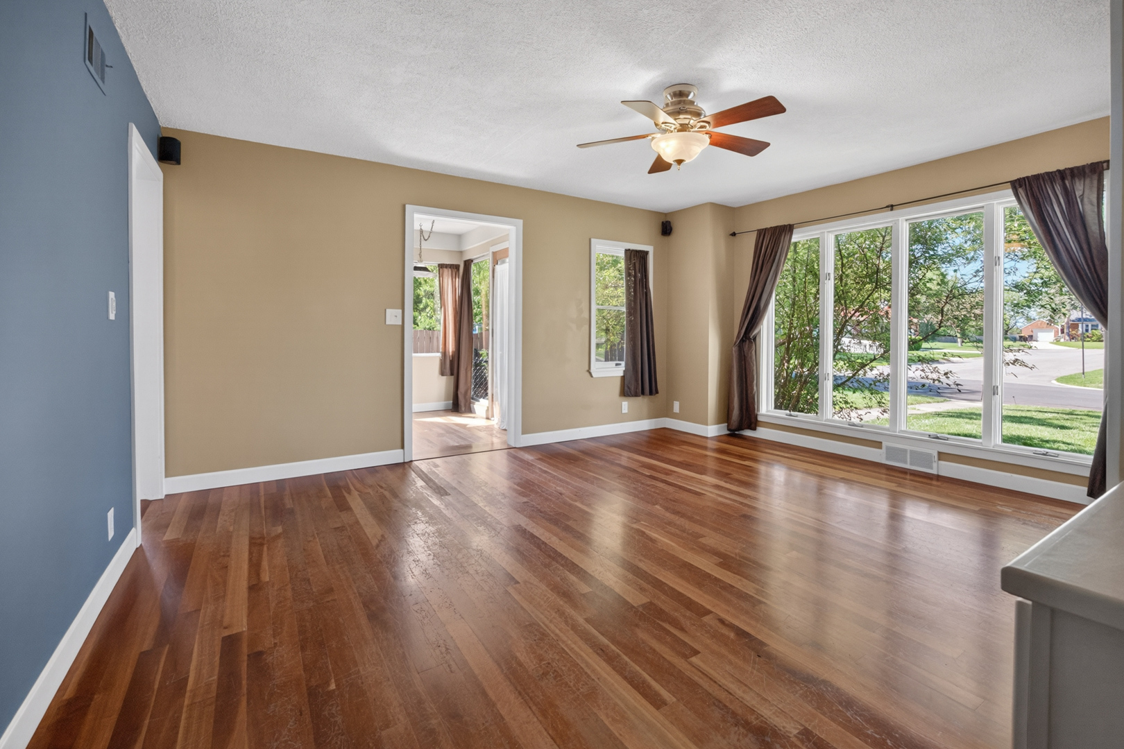 18 Mc Cormick Boulevard Normal, IL 61761 - Photo 6 of 25 a view of n empty room with wooden floor and fan