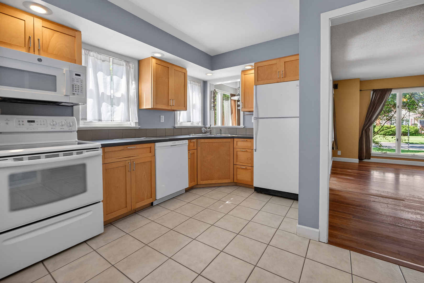 18 Mc Cormick Boulevard Normal, IL 61761 - Photo 8 of 25 a kitchen with a stove a sink and a refrigerator