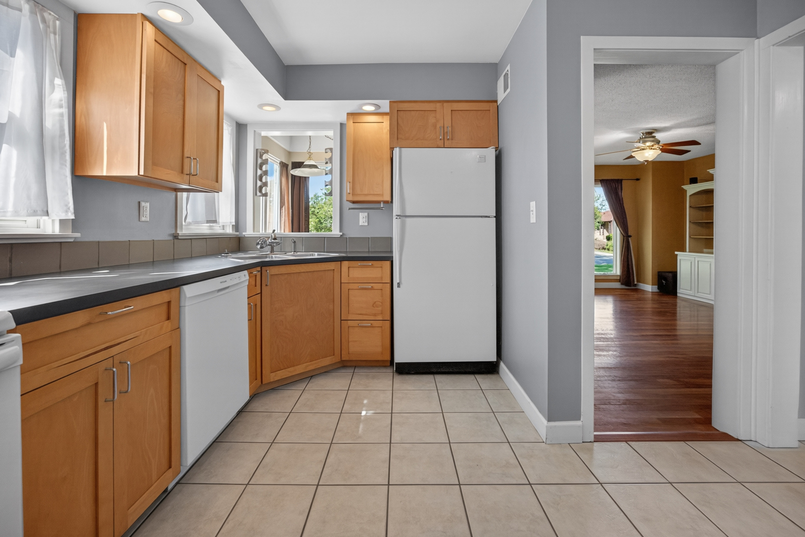 18 Mc Cormick Boulevard Normal, IL 61761 - Photo 9 of 25 a kitchen with stainless steel appliances granite countertop a refrigerator and a sink