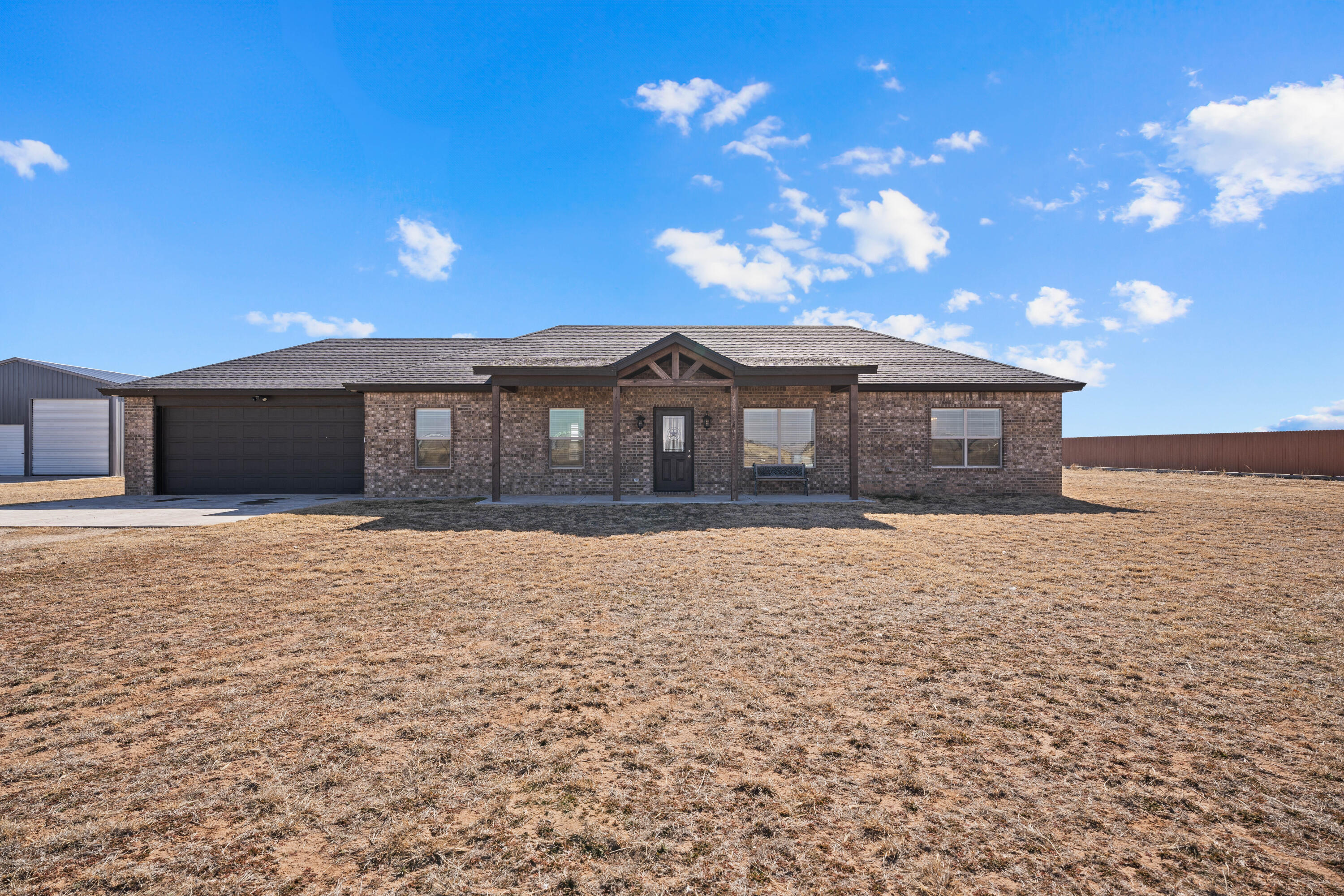 8907 County Road 6100 Shallowater, TX 79363 - Photo 1 of 24 a front view of a house with a yard