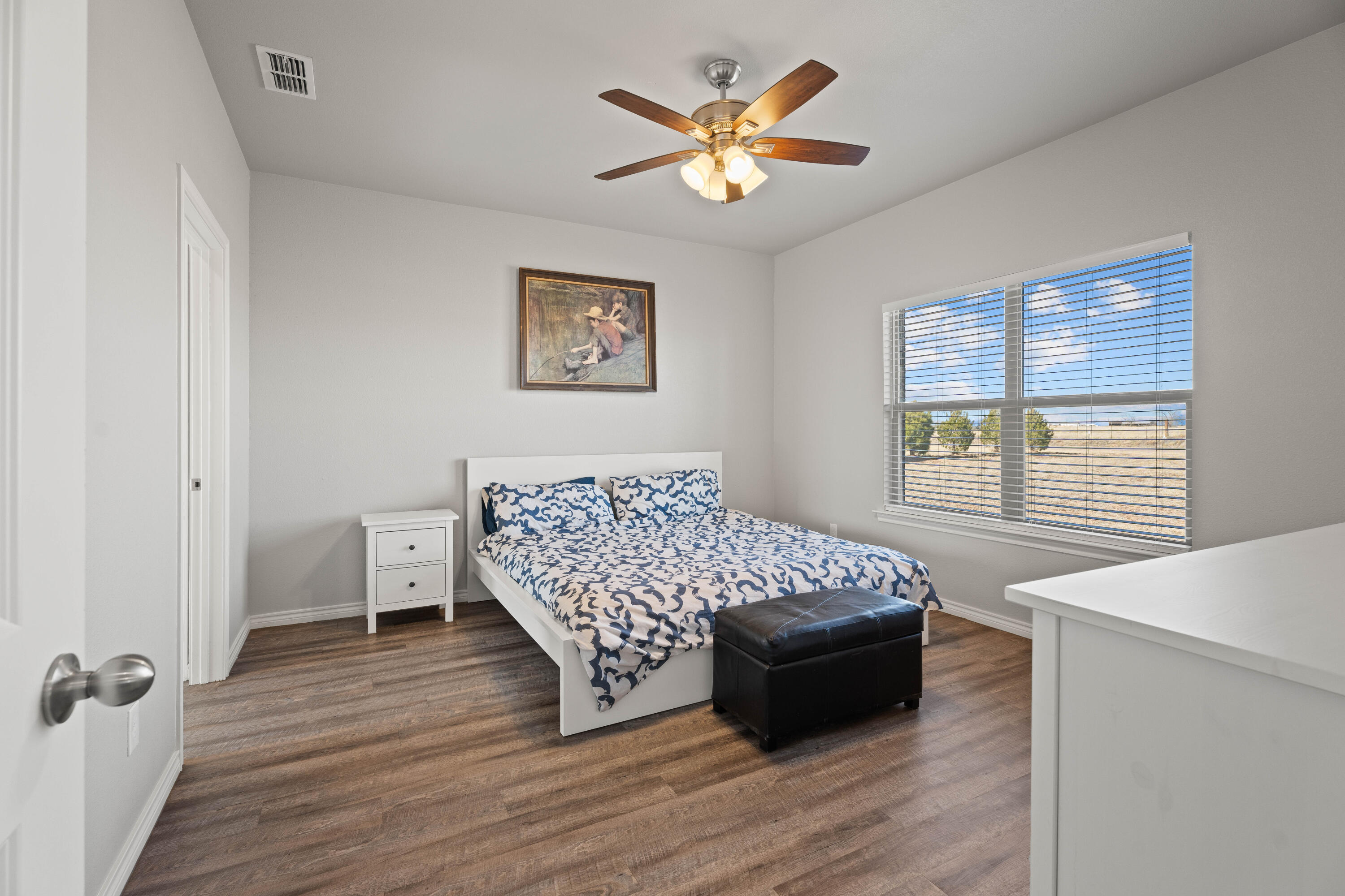 8907 County Road 6100 Shallowater, TX 79363 - Photo 12 of 24 a bedroom with a bed and a window