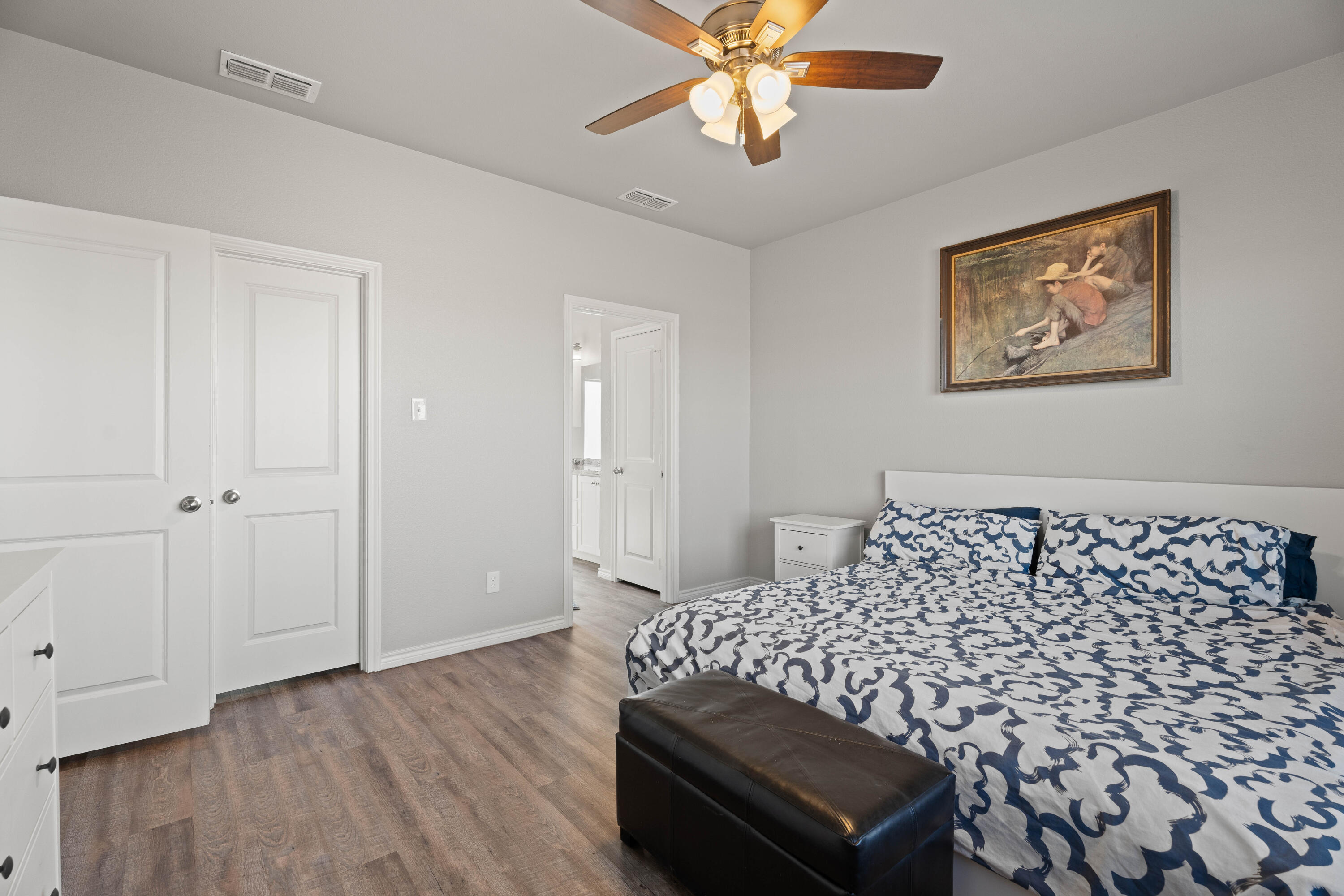 8907 County Road 6100 Shallowater, TX 79363 - Photo 13 of 24 a bedroom with bed and wooden floor