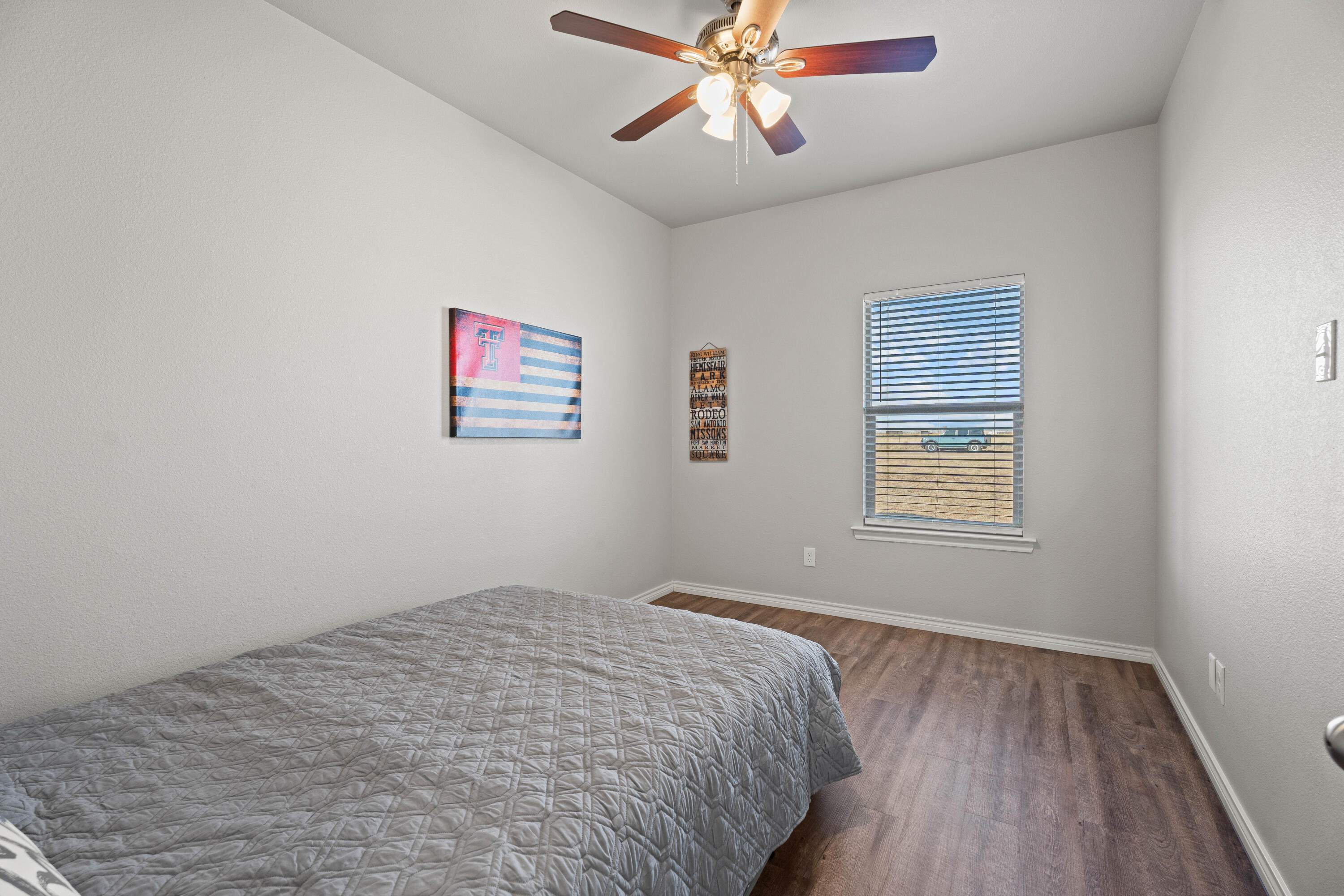 8907 County Road 6100 Shallowater, TX 79363 - Photo 19 of 24 a bedroom with a bed and a window