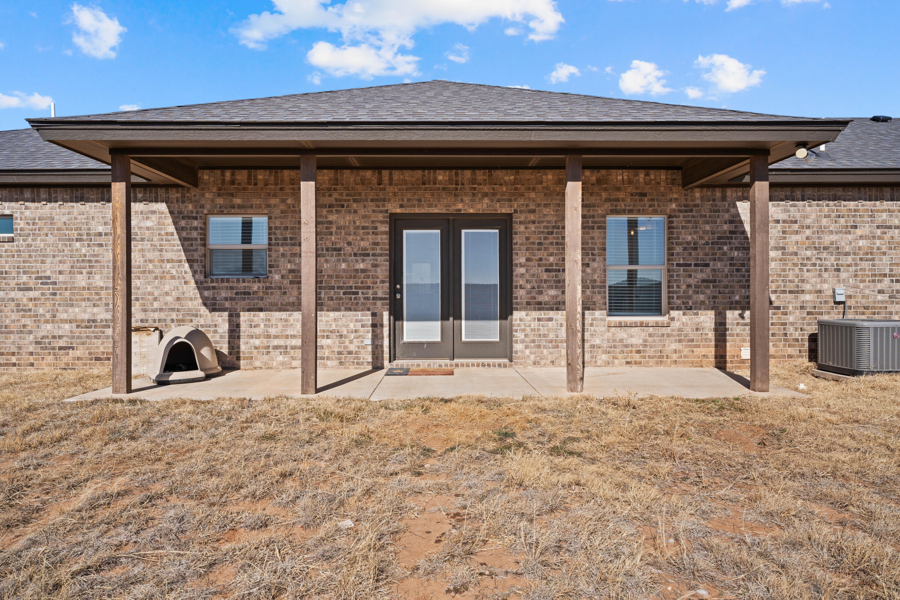 8907 County Road 6100 Shallowater, TX 79363 - Photo 24 of 24 a view of a porch with a table and chairs