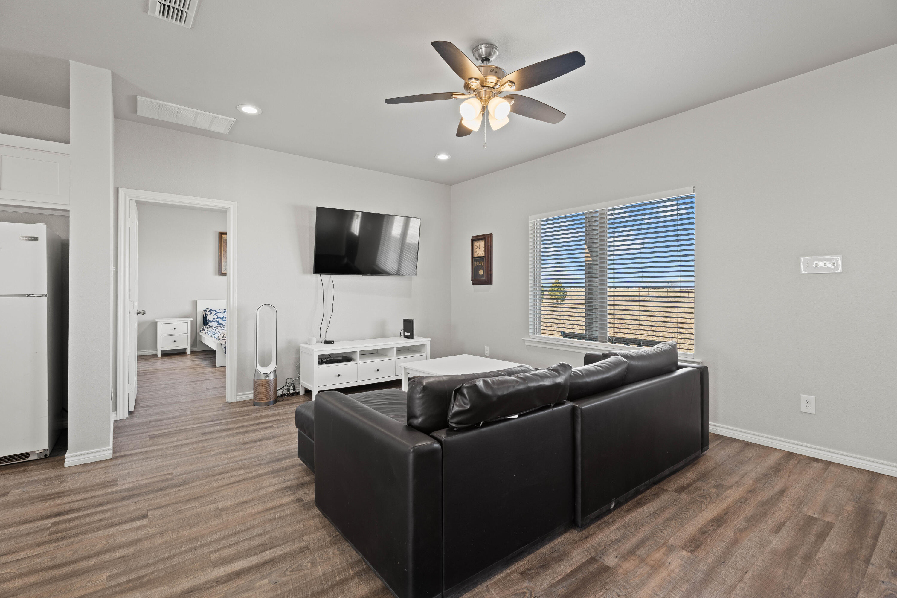 8907 County Road 6100 Shallowater, TX 79363 - Photo 5 of 24 a living room with furniture and a flat screen tv