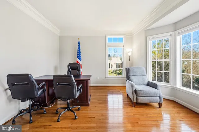a living room with furniture fireplace and flat screen tv