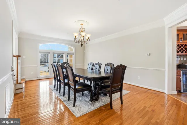 a large kitchen with a table and chairs