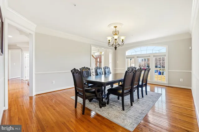 a view of a livingroom with furniture and chandelier
