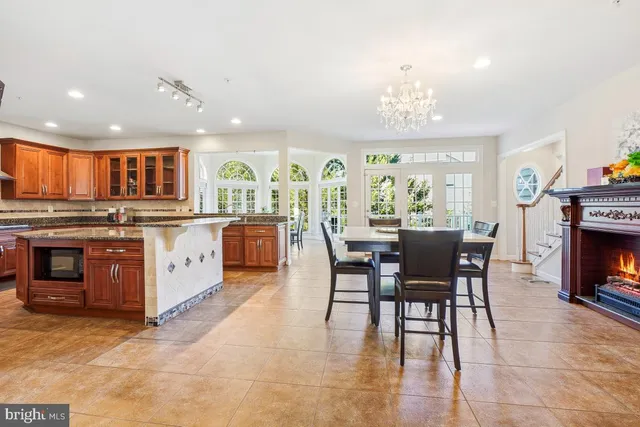 a kitchen with stainless steel appliances granite countertop a sink and cabinets