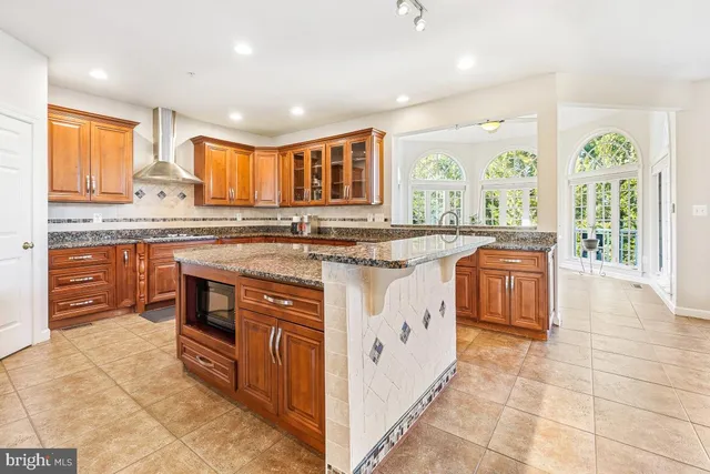 a view of a dining room and livingroom with furniture window and outside view
