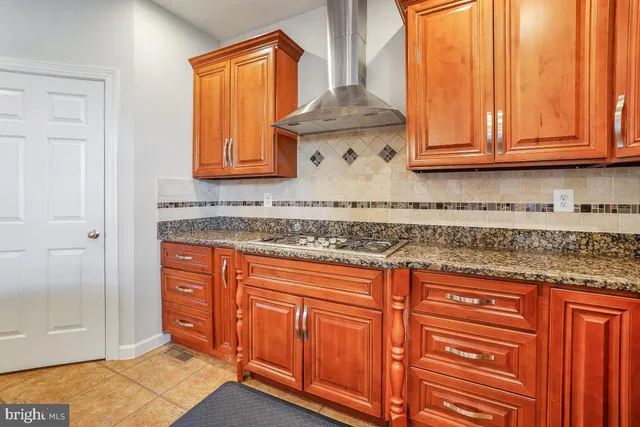a view of a living room with furniture and a fireplace