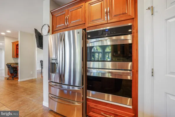 a living room with furniture and a ceiling fan