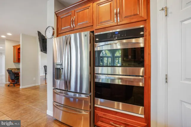 a living room with furniture and a ceiling fan