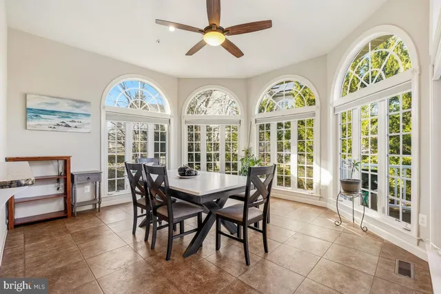 a spacious bathroom with a double vanity sink and mirror
