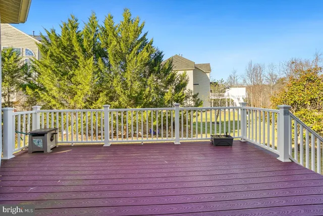 a spacious bathroom with a double vanity sink a mirror a bathtub and next to a window