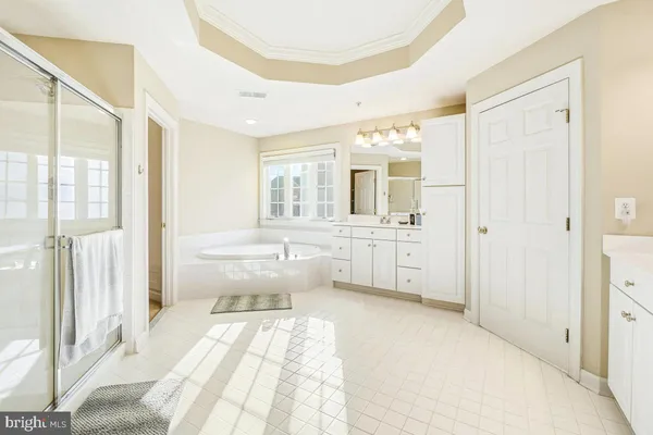 a view of a hallway with wooden shelves
