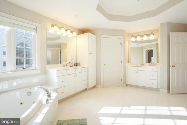 a bathroom with a granite countertop shower a toilet and a shower
