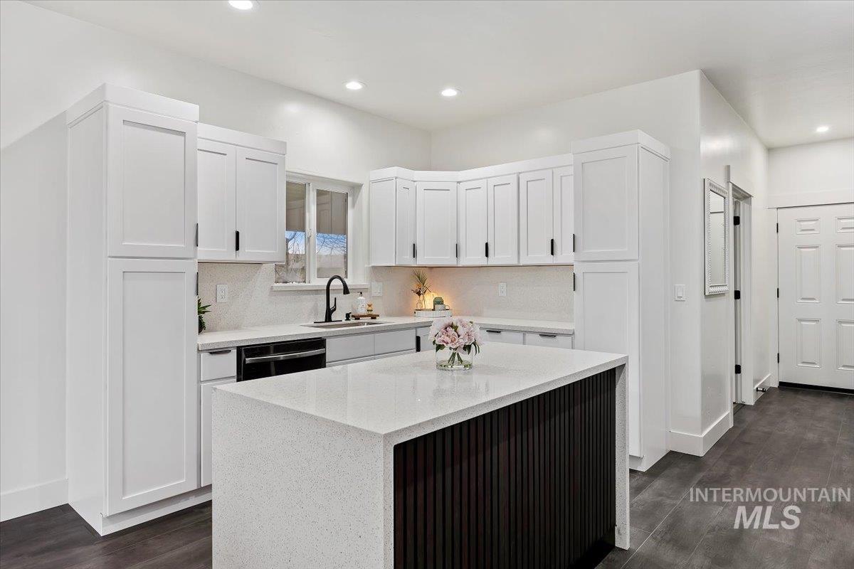 1189 Trail Crest Road Twin Falls, ID 83301 - Photo 15 of 44 Kitchen with white cabinetry, light stone countertops, dark wood-style floors, and recessed lighting