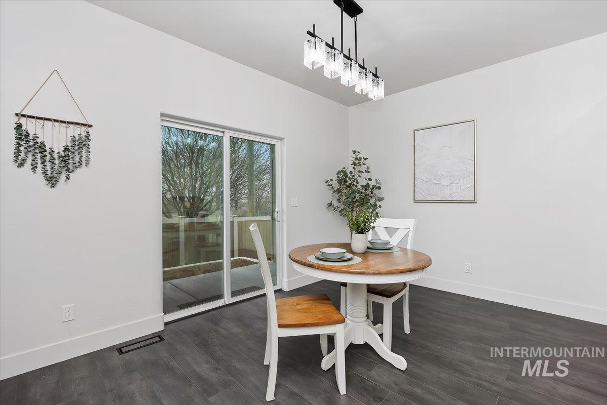 1189 Trail Crest Road Twin Falls, ID 83301 - Photo 17 of 44 Dining area featuring dark wood finished floors