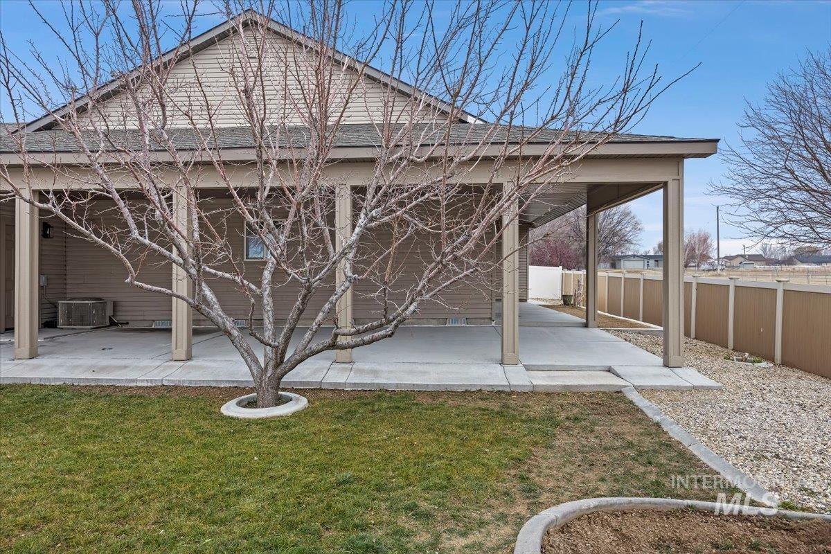 1189 Trail Crest Road Twin Falls, ID 83301 - Photo 32 of 44 Back of house with a fenced backyard and a patio area