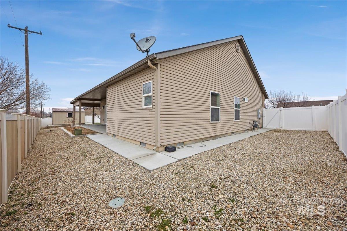 1189 Trail Crest Road Twin Falls, ID 83301 - Photo 33 of 44 View of property exterior with a fenced backyard, crawl space, and a gate