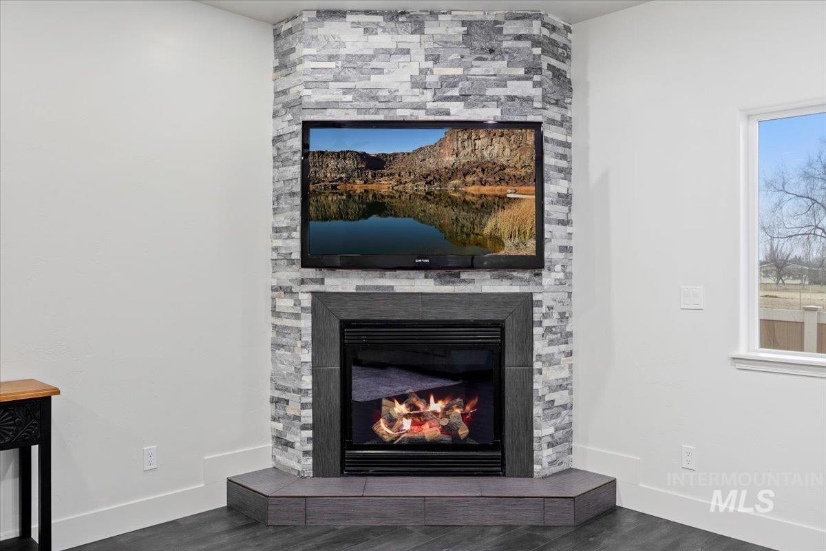 1189 Trail Crest Road Twin Falls, ID 83301 - Photo 9 of 44 Detailed view of a fireplace and wood finished floors
