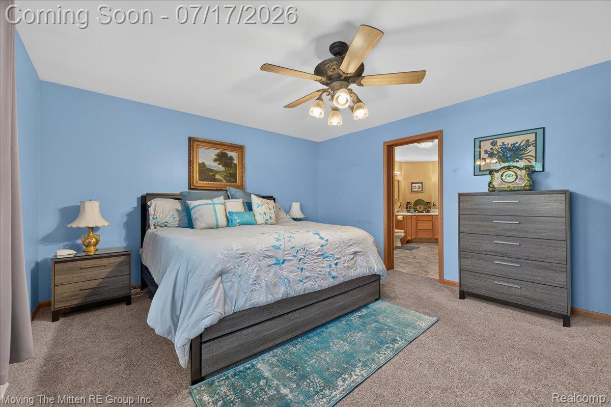40162 Alden Road Belleville, MI 48111 - Photo 17 of 67 Spacious bedroom featuring blue wall finishes, neutral carpeting, and a ceiling fan with integrated lighting
