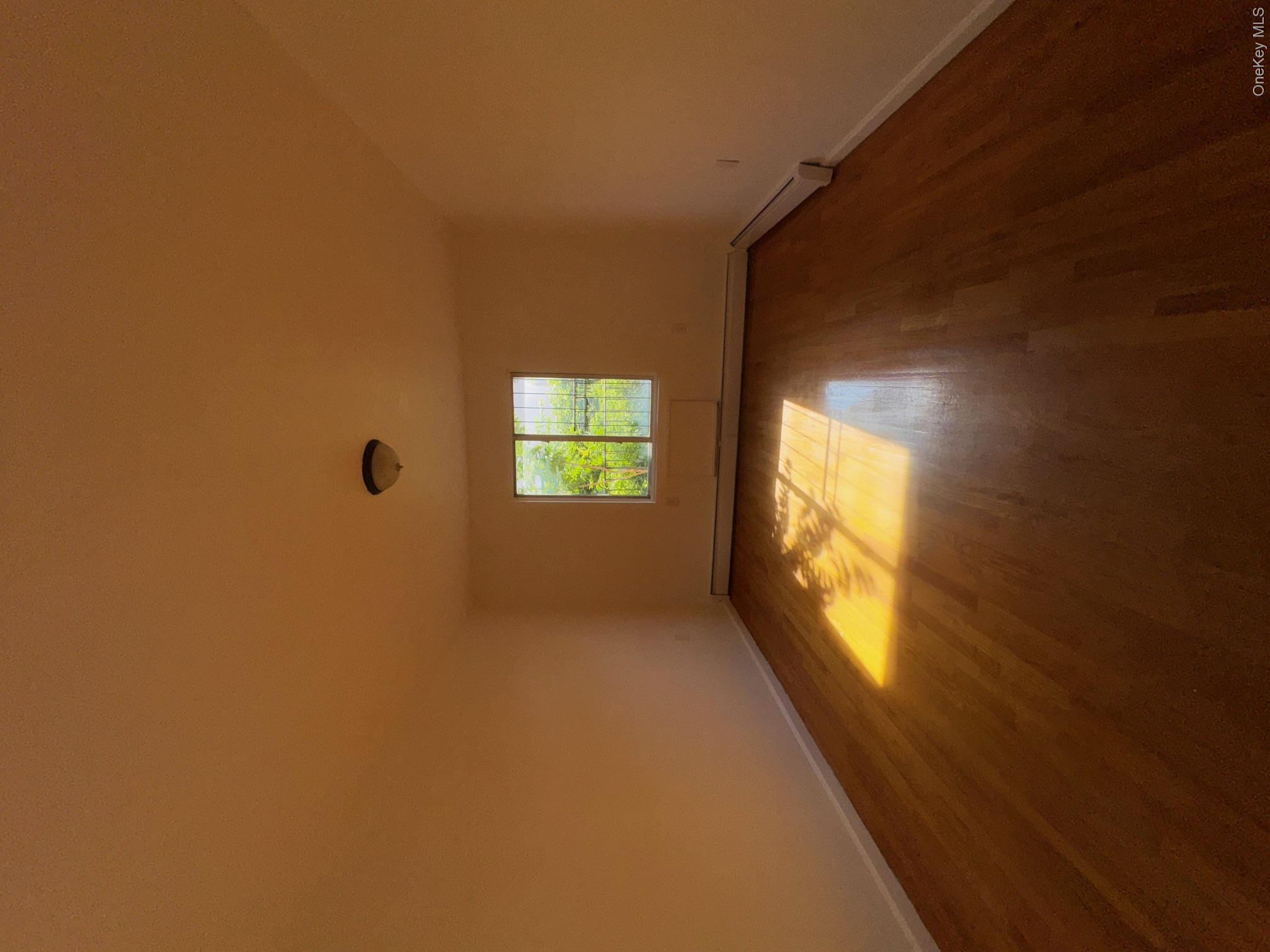 631 Coster Street Bronx, NY 10474 - Photo 10 of 17 an empty room with a window