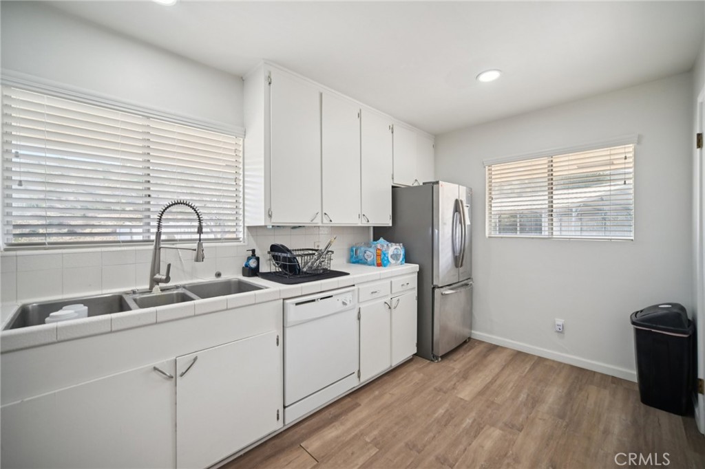 47078 Kings Canyon Road Lancaster, CA 93536 - Photo 15 of 63 a kitchen with stainless steel appliances granite countertop a sink stove and refrigerator
