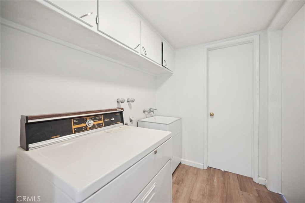 47078 Kings Canyon Road Lancaster, CA 93536 - Photo 16 of 63 a utility room with dryer and washer