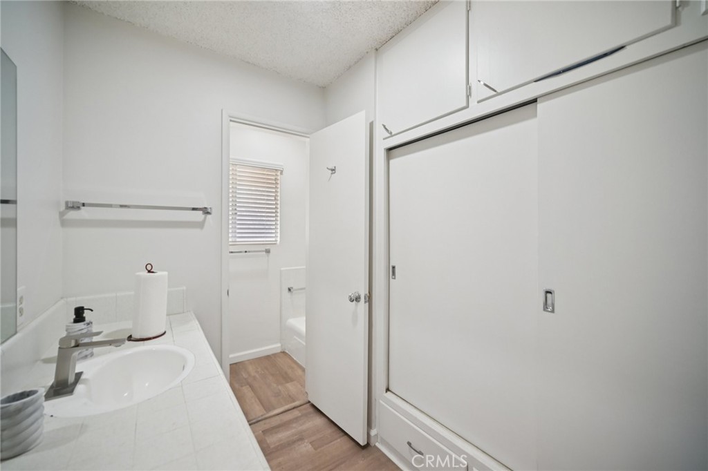 47078 Kings Canyon Road Lancaster, CA 93536 - Photo 23 of 63 a bathroom with a sink and a shower