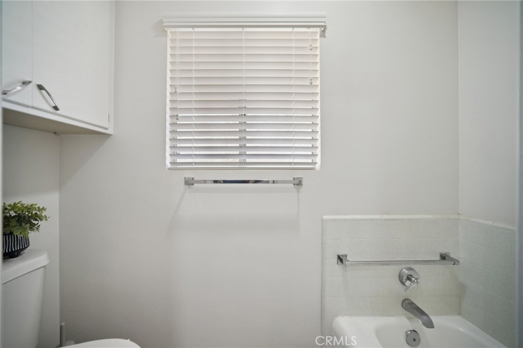 47078 Kings Canyon Road Lancaster, CA 93536 - Photo 24 of 63 a bathroom with a bathtub and shower