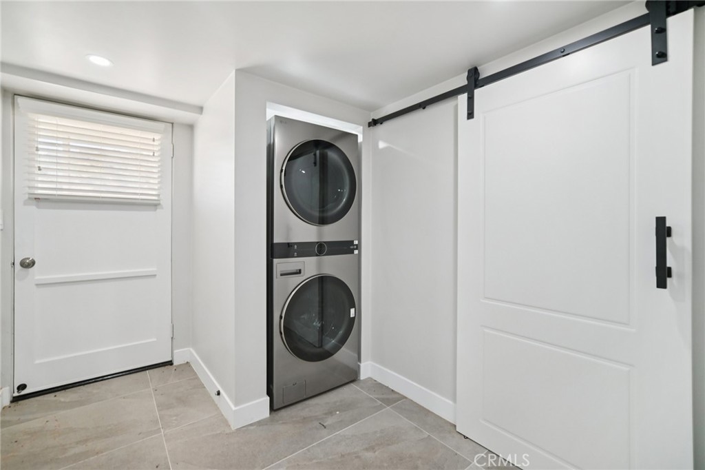 47078 Kings Canyon Road Lancaster, CA 93536 - Photo 26 of 63 a utility room with dryer and washer