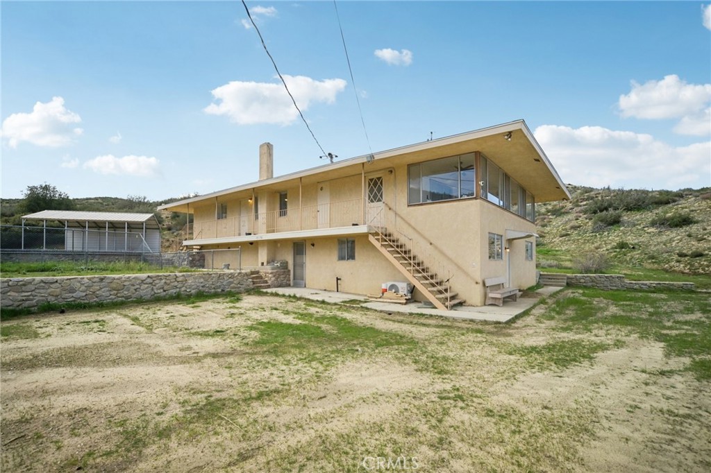 47078 Kings Canyon Road Lancaster, CA 93536 - Photo 3 of 63 a view of a house with a yard