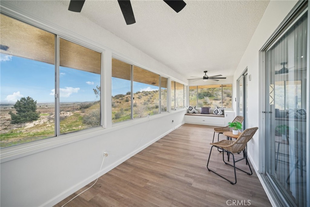 47078 Kings Canyon Road Lancaster, CA 93536 - Photo 39 of 63 a living room with furniture and a large window