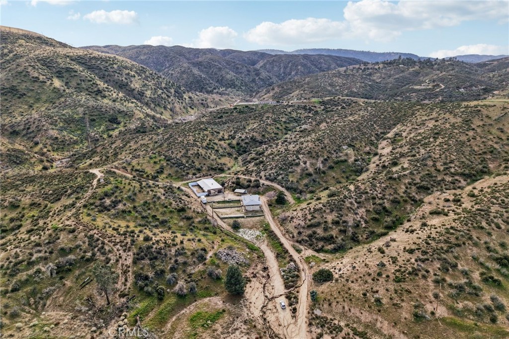 47078 Kings Canyon Road Lancaster, CA 93536 - Photo 51 of 63 an aerial view of residential house with yard and mountain view