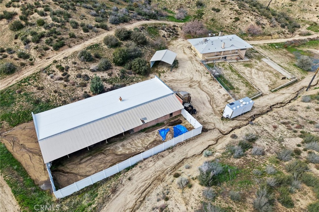 47078 Kings Canyon Road Lancaster, CA 93536 - Photo 56 of 63 an aerial view of a house with a yard and lake view