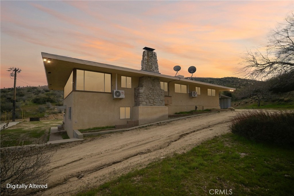 47078 Kings Canyon Road Lancaster, CA 93536 - Photo 60 of 63 a front view of a house with a yard