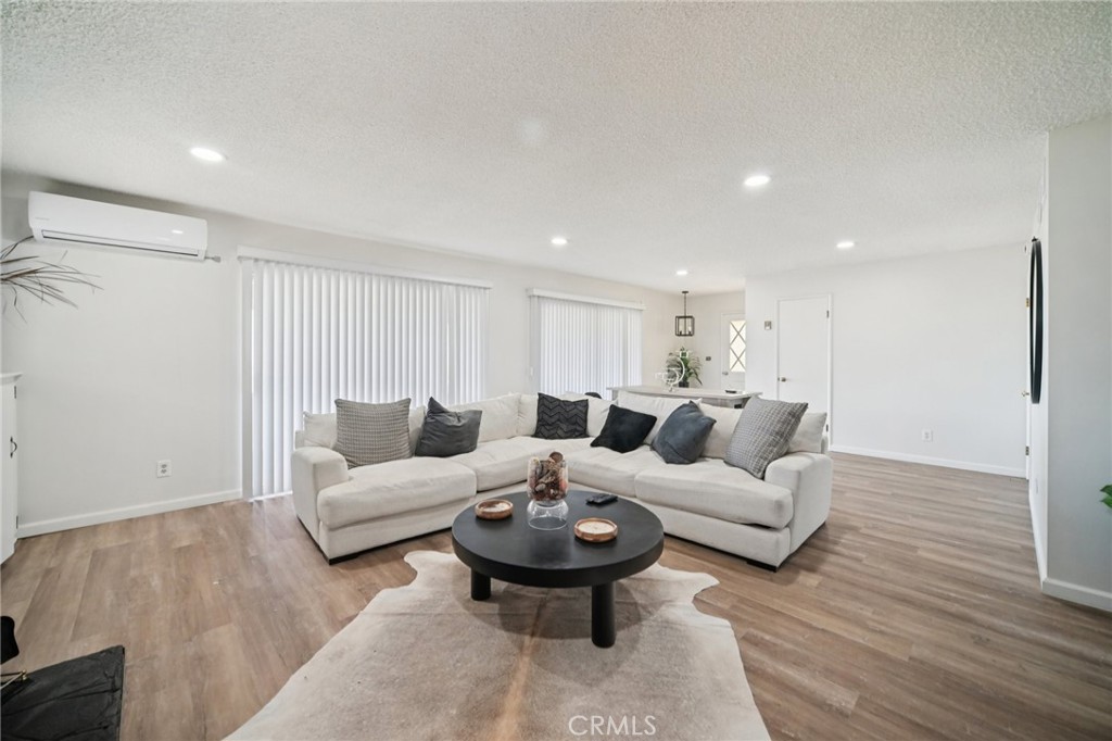 47078 Kings Canyon Road Lancaster, CA 93536 - Photo 6 of 63 a living room with furniture and a wooden floor