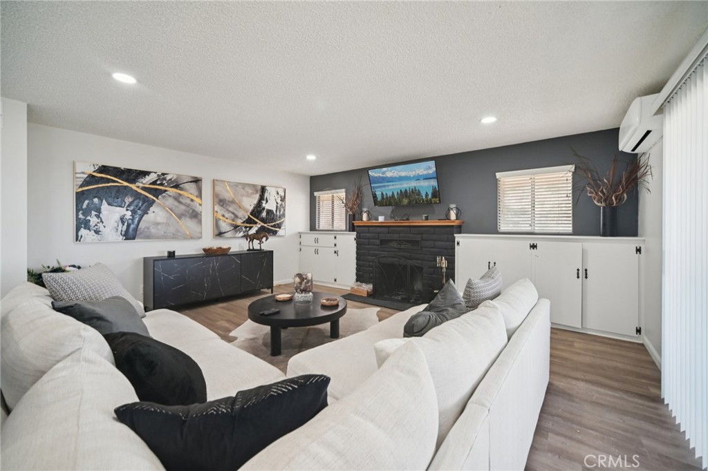 47078 Kings Canyon Road Lancaster, CA 93536 - Photo 7 of 63 a living room with furniture and a fireplace