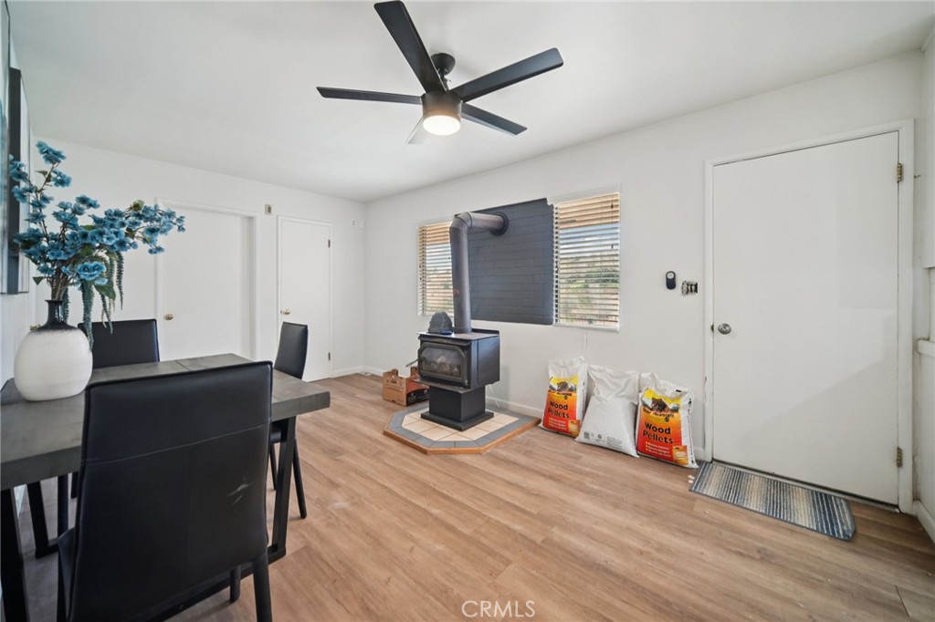 47078 Kings Canyon Road Lancaster, CA 93536 - Photo 9 of 63 a work room with furniture and wooden floor