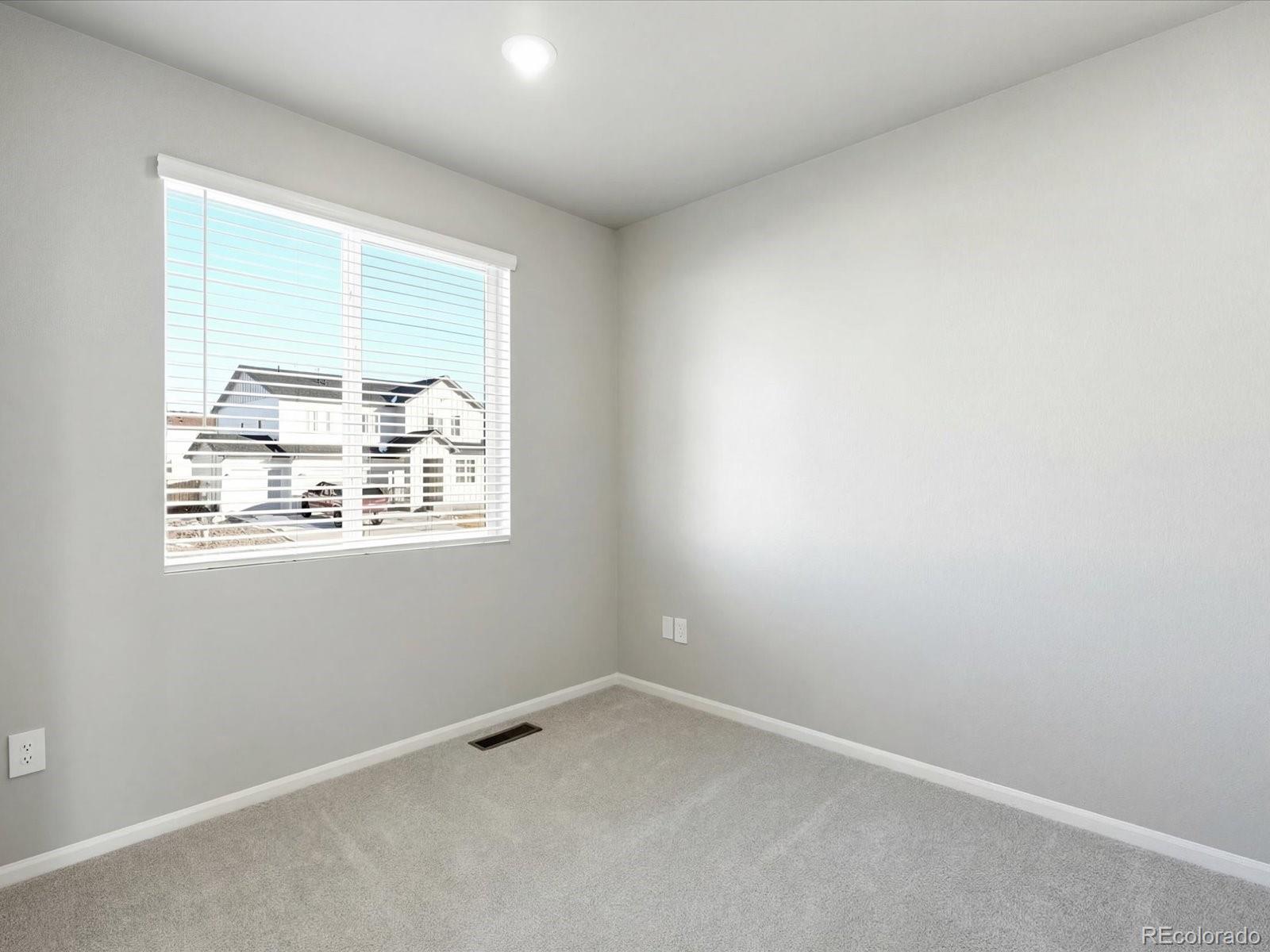 7317 West 27th St Road Greeley, CO 80634 - Photo 3 of 28 an empty room with a window