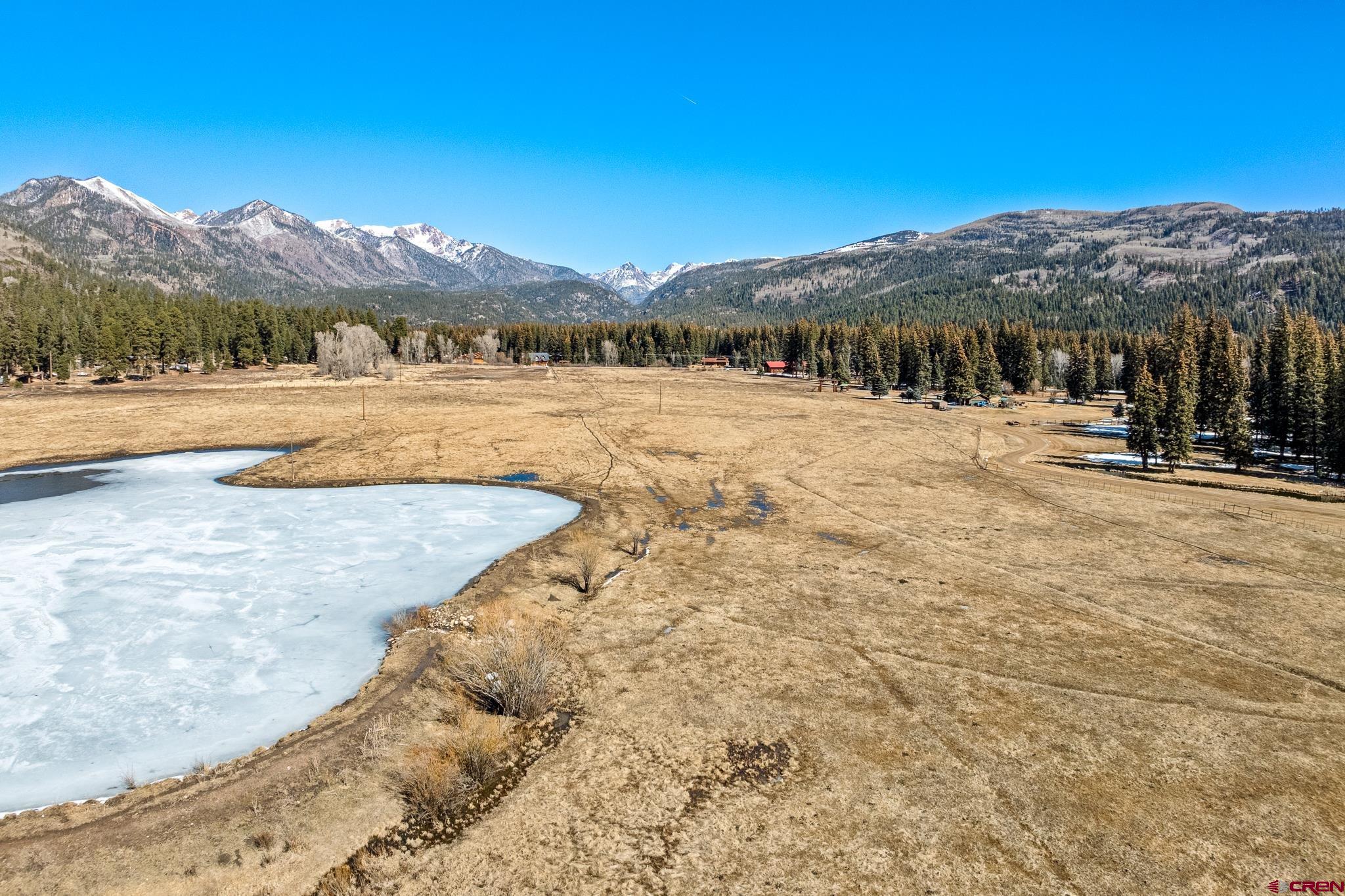 156 Golden Forest Road Bayfield, CO 81122 - Photo 18 of 28 a view of a lake with a mountain in the background