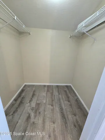 a view of a room with racks on the wall