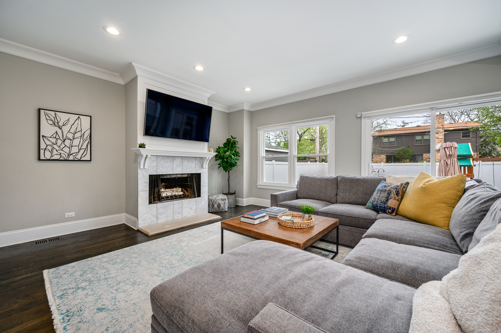 808 Rolling Pass Glenview, IL 60025 - Photo 12 of 33 a living room with furniture a flat screen tv and a fireplace