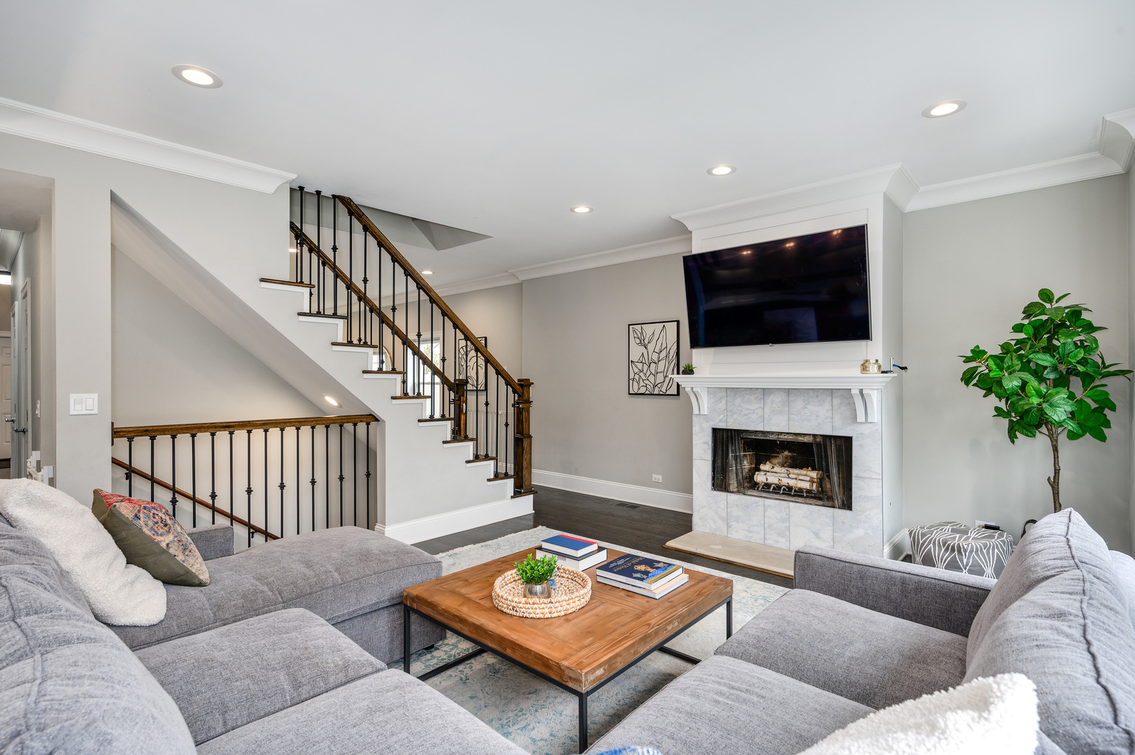 808 Rolling Pass Glenview, IL 60025 - Photo 13 of 33 a living room with furniture a flat screen tv and a fireplace