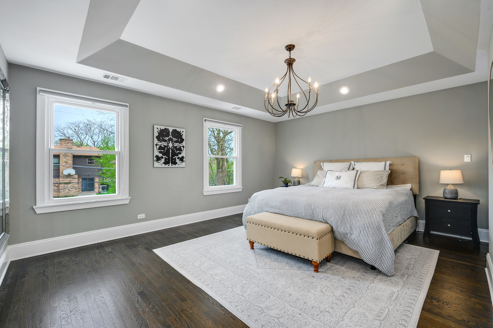808 Rolling Pass Glenview, IL 60025 - Photo 15 of 33 a spacious bedroom with a bed chandelier and window