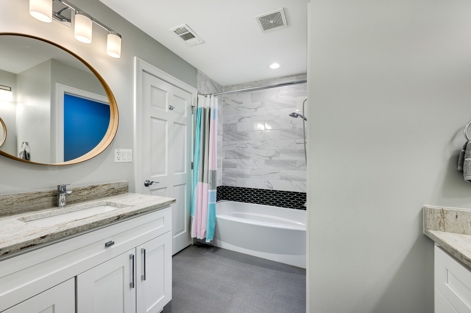 808 Rolling Pass Glenview, IL 60025 - Photo 22 of 33 a bathroom with a sink a mirror and a bathtub